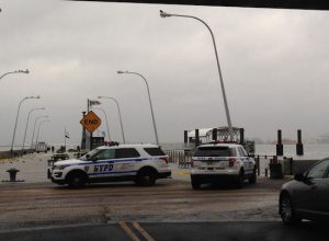 NYPD vehicles block off 69th Street Pier entrance during police investigation. Eagle photos by John Alexander