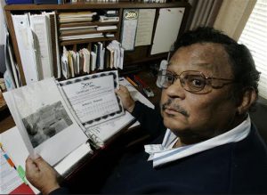Art Thomas displays DNA certificates he has received in researching his ancestry at his home in Springfield, Ohio. Thomas purchased three tests that confirm that, although he is black, he has white ancestors. AP file photo by Al Behrman