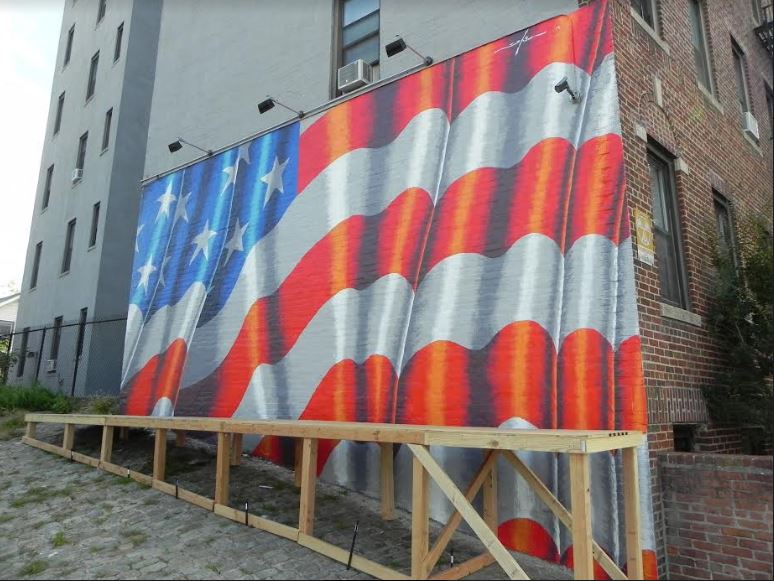 Artist Scott LoBaido’s mural of an American flag on an 86th Street building has drawn a great deal of praise in Bay Ridge. Eagle photo by Paula Katinas