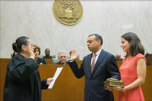Judge Sanket J. Bulsara (center) was officially sworn in as a magistrate judge in the Eastern District of New York by Chief Judge Dora Irizarry while his wife Christine DeLorenzo looked on. Eagle photos by Rob Abruzzese