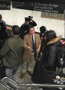 Assemblymember Robert Carroll, who supports the efforts of the Riders Alliance, hands out Subway Delay Actions Kits to straphangers entering the Grand Central subway station. Photos courtesy of the Riders Alliance