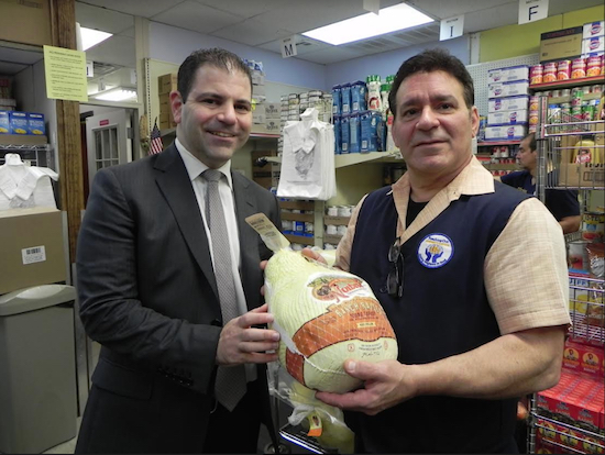 Michael Diaco (left), a member of the 86th Street Bath Beach Kiwanis Club, came to Reaching-Out Community Services Inc. on Tuesday to meet Executive Director Thomas Neve and to make sure the turkeys the club was donating arrived in time for Thanksgiving. Eagle photo by Paula Katinas