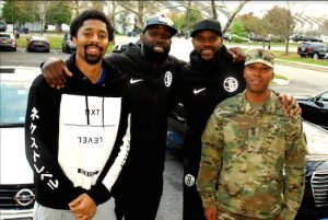 (L-R) Brooklyn Nets players Spencer Dinwiddie, Quincy Acy and Trevor Booker with Command Sergeant Major Javier Lugo with the Joint Task Force Empire Shield of the New York National Guard. Brooklyn Eagle photos by Arthur De Gaeta