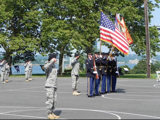 The U.S. Army Color Guard at Ft. Hamilton stands at attention during the National Anthem. Eagle photo by Paula Katinas