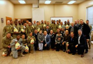 Members of the Rotary Club of Verrazano and the Salaam Club of New York pose with soldiers and their families at the Fort Hamilton Army Base. Eagle photos by Arthur De Gaeta