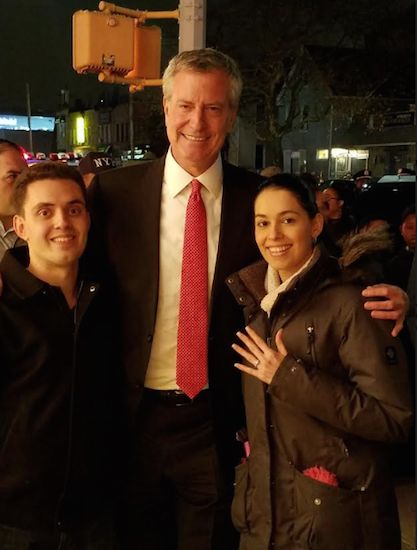 Priscilla Consolo and her fiance Adam Diamond celebrate their engagement at Brooklyn Democratic Party Chairman Frank Seddio’s annual holiday event. Mayor Bill de Blasio was a good sport, according to Consolo, who said the mayor graciously waited for Diamond to propose to her before giving his remarks at the party. Photo courtesy of Priscilla Consolo