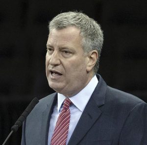 Mayor Bill de Blasio dissed the Nets at a town hall meeting in Queens on Tuesday. The team responded on Twitter by inviting de Blasio to Barclays Center. AP file photo by John Minchillo