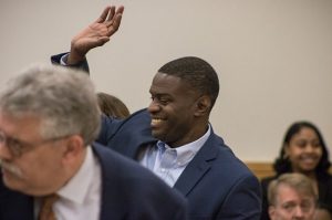 Mark Denny waves to his family in Brooklyn Supreme Court as he walks into his exoneration. Eagle photos by Paul Frangipane