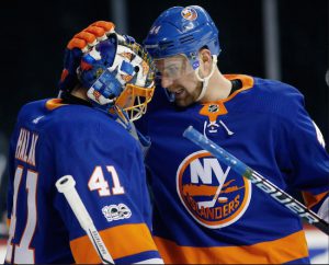 Veteran goalie Jaroslav Halak gets some love from defenseman Calvin de Haan Monday night at Downtown’s Barclays Center after back-stopping the Islanders to a 3-1 victory over the Washington Capitals. AP Photo by Kathy Willens
