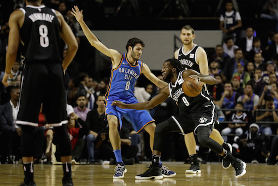 Brooklyn Nets' Demarre Carroll moves the ball past Oklahoma City Thunder's Alex Abrines in the first half of their regular-season NBA basketball game in Mexico City, Thursday, Dec. 7, 2017. AP Photo/Rebecca Blackwell