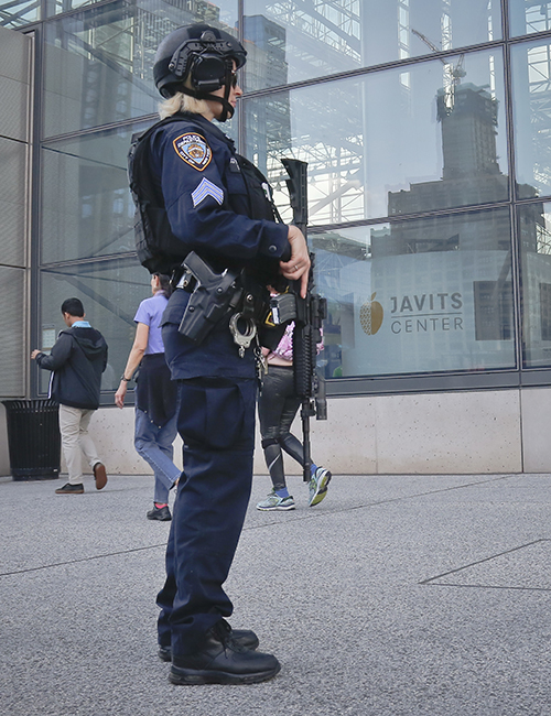 NYPD anti-terror officer patrol outside the Javits Center before the New York City Marathon on Nov. 2, following the deadliest terrorist attack since 9/11, when a man driving a car killed eight cyclists in lower Manhattan. AP Photo/Bebeto Matthews