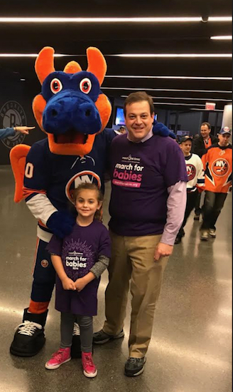John Quaglione and his daughter Natalie Grace attended a New York Islanders hockey game at Barclays Center on Nov. 28 (Giving Tuesday) and met the team mascot. The March of Dimes was designated as the Charity of the Game that night. Photo courtesy of Quaglione