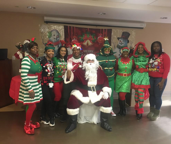 Santa Claus and his helpers threw a Christmas party for students from local schools. Photo courtesy of Interfaith Medical Cente