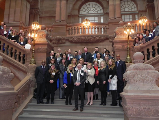 Led by President and CEO Andrew Hoan (front and center) the Brooklyn Chamber of Commerce delegation gathers on the grand inside the State Capitol in Albany during a two-day trip in March. Eagle file photo by Paula Katinas