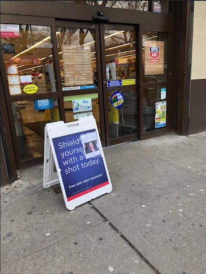 A sign outside a Rite Aid on 18th Avenue in Bensonhurst advises residents to get their flu shots in the pharmacy. Eagle photo by Paula Katinas