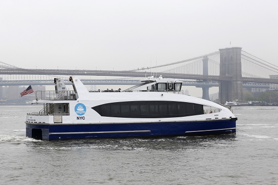 A NYC Ferry passes the Brooklyn Bridge as it departs lower Manhattan for Rockaway, Queens, May 1, 2017. AP Photo/Mark Lennihan