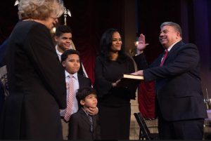 Eric Gonzalez (right) is sworn in by Chief Judge Janet DiFiore (left) during a special ceremony in Williamsburg on Sunday while his wife Dagmar Gonzalez and their three kids look on. Photos courtesy of the Brooklyn DA’s Office