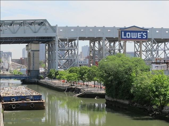 Two Trees Management is purchasing two sites in Gowanus for more than $100 million, according to Crain’s New York Business. The sign for one of the sites, the Lowe’s Home Improvement store, can be seen rising next to the Gowanus Canal. Photo courtesy of Katia Kelly, @pardonmeforasking