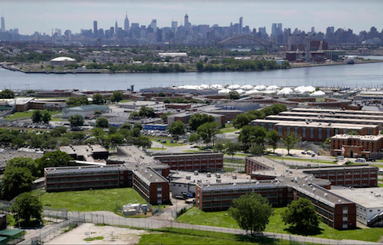 In a June 20, 2014, file photo, the Rikers Island jail complex stands in New York. The de Blasio Administration announced that the city’s jails have fewer inmates from Brooklyn. AP Photo/Seth Wenig, File