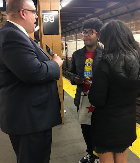 Councilmember Justin Brannan, pictured talking to riders at the 59th Street station during the campaign, says he’s not surprised that transit issues were the Number One priority of constituents who responded to a survey. Photo courtesy of Brannan’s office