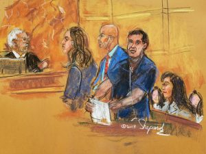 Joaquin “El Chapo” Guzman stands ready in Brooklyn’s federal court to read a note he wrote to the Judge Brian Cogan. From left: Judge Cogan, Assistant U.S. Attorney Andrea Goldbarg, defense attorney, Eduardo Balarezo, Guzman, his wife Emma Coronel Aispuro and their twin daughters. Court sketch by Shirley and Andrea Shepard