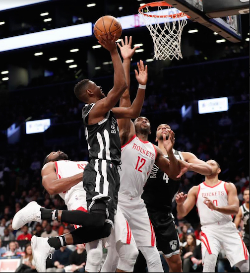 Caris LeVert rises for two of his nine points Tuesday night at Barclays Center before leaving the game with a concussion following a violent and borderline illegal screen set by Houston’s Nene. AP Photo by Kathy Willens