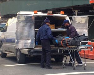 A man’s body was found on Thursday in the basement of the landmarked Polhemus building, a former Long Island College Hospital (LICH) property undergoing conversion into luxury condos. A neighbor who wishes to remain unidentified took this photo of the body being placed in an ambulance. Courtesy of a Brooklyn Eagle neighbor