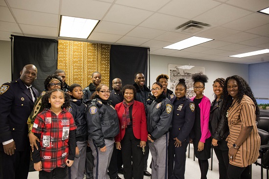 The 81st Precinct Explorers, DJ Annie Red (left in red), and Arra Dingle (second from right) stole the show at this year's Kings County Civil Court Black History Month event. Eagle photos by Edward King