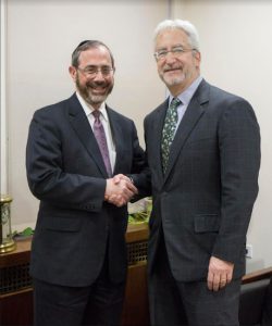 Barry Stern (left), president and CEO of New York Community Hospital, and Kenneth Gibbs, his counterpart at Maimonides Medical Center, shake hands to seal the agreement. Photo courtesy of Maimonides Medical Center