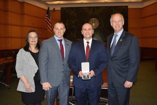Federal Marshal Trevor McPolin (second from right), from the Eastern District of New York, was given the Congressional Badge of Bravery by U.S. Rep. Dan Donovan (right) during a ceremony. Also pictured are Chief Judge Dora Irizarry and U.S. Marshall Bryan Mullee. Eagle photos by Rob Abruzzese