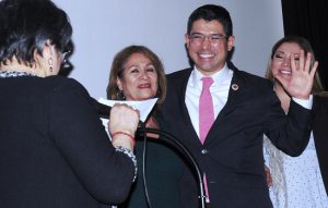 City Councilmember Carlos Menchaca, surrounded by his mother Magdalena and sister Christina Dominguez, is sworn into office by former NYS Secretary of State Lorraine Cortes-Vasquez. Eagle photos by Arthur De Gaeta
