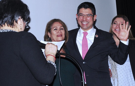City Councilmember Carlos Menchaca, surrounded by his mother Magdalena and sister Christina Dominguez, is sworn into office by former NYS Secretary of State Lorraine Cortes-Vasquez. Eagle photos by Arthur De Gaeta
