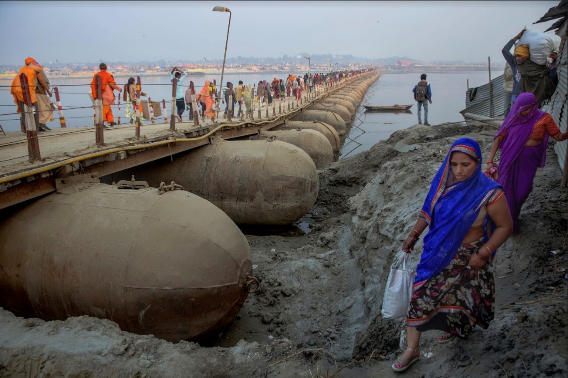A pontoon bridge traditionally uses anchored floats to create a continuous passageway for pedestrians and vehicles. AP Photo/Rajesh Kumar Singh
