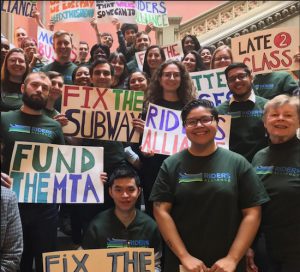 Members of the Riders Alliance organized a protest rally at the State Capitol to demand funding for subway and bus repairs. Photo courtesy of Riders Alliance