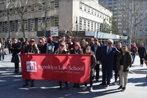 Students from Brooklyn Law School with Dean Nicholas Allard (right in navy suit), who showed up to support the call for gun control. Eagle photo by Rob Abruzzese