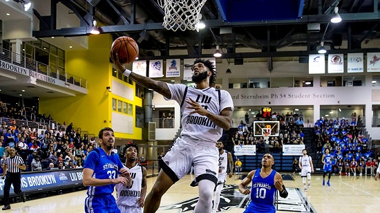 Long Island University (LIU) senior Joel Hernandez soars to the basket for two of his game-high 26 points Wednesday night, leading the Blackbirds past neighborhood rival St. Francis Brooklyn in the NEC Quarterfinals at the Steinberg Wellness Center. Photos courtesy of LIU Brooklyn Athletics