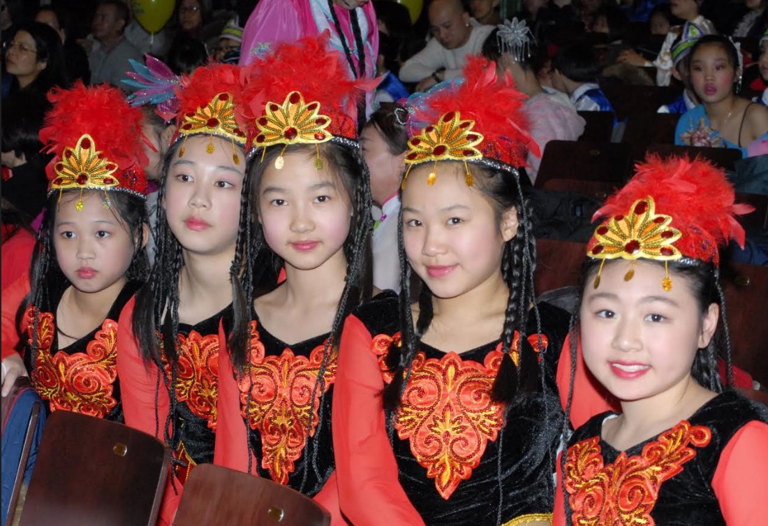 Young ladies are seen in colorful costumes at the Asian Lunar New Year event at New Utrecht.
