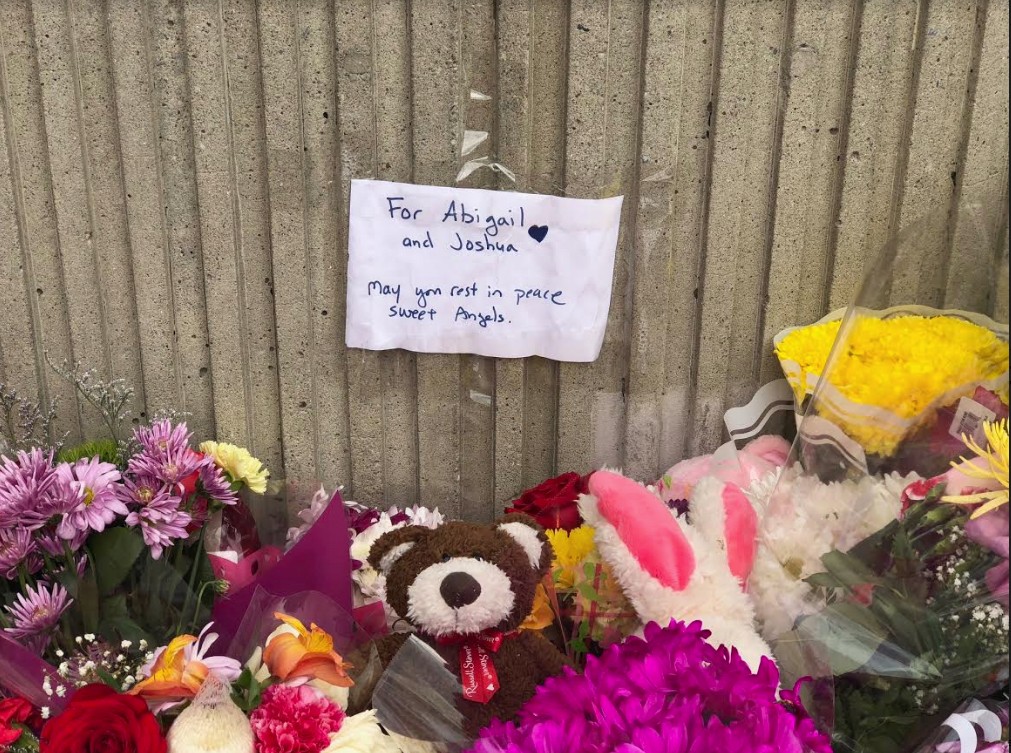 Someone taped this heartfelt, handwritten note to the wall next to the makeshift memorial.