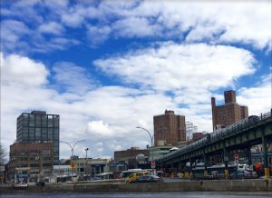 A busy highway runs past Williamsburg Bridge Plaza, which is surrounded by century-old bank buildings. Eagle photos by Lore Croghan