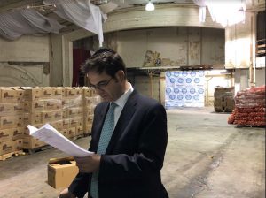 Councilmember Kalman Yeger checks his list in the food distribution warehouse on New Utrecht Avenue on the day of Passover food giveaway. Photo courtesy of Yeger’s office