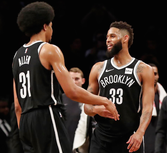 Rookie Jarrett Allen reaches out for a touch of Allen Crabbe’s red-hot hand Monday night in Downtown Brooklyn as the Nets’ sharp-shooter sparked the team’s first three-game winning streak of this soon-to-be-completed season. AP photo by Kathy Willens