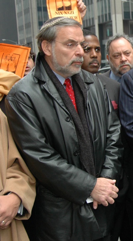 Dov Hikind, seen in action at a protest last year, will not seek re-election.