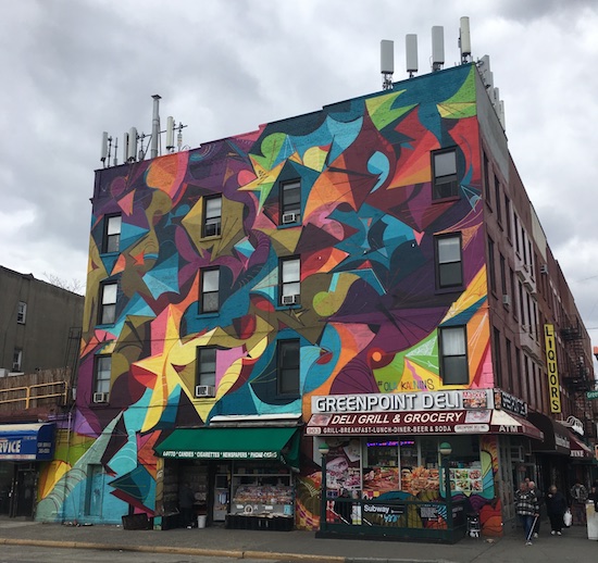 The mural by Ola Kalnins covers the entire building.