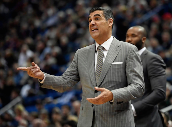 Villanova head coach Jay Wright benefitted from the hard work of assistant head coach and former Brooklyn Friends School standout Kyle Neptune (background, right) this month as the Wildcats grabbed their second national title in the past three years. AP Photo by Jessica Hill