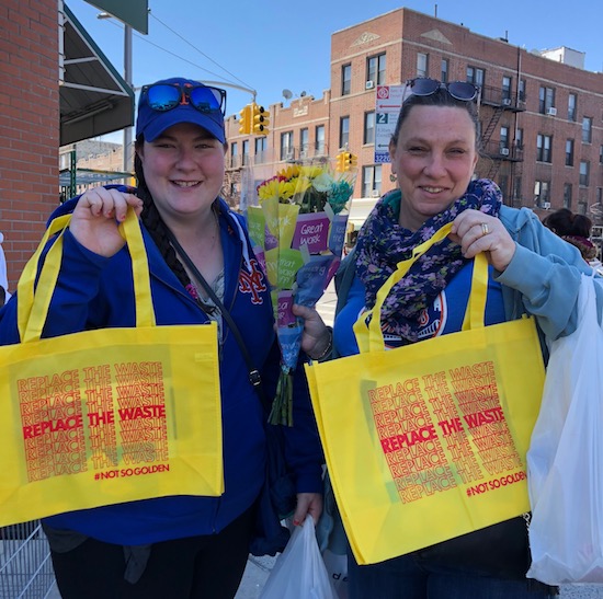 Volunteers handed out lots of reusable shopping bags outside supermarkets on Earth Day.