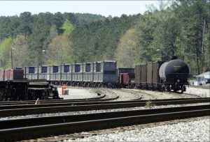 This April 12 photo shows containers that were loaded with tons of sewage sludge in Parrish, Ala. More than two months after the so-called “Poop Train” rolled in from New York City, Hall says her small town smells like rotting corpses. Some say the trainloads of New Yorkers’ excrement is turning Alabama into a dumping ground for other states’ waste. AP Photo/Jay Reeves