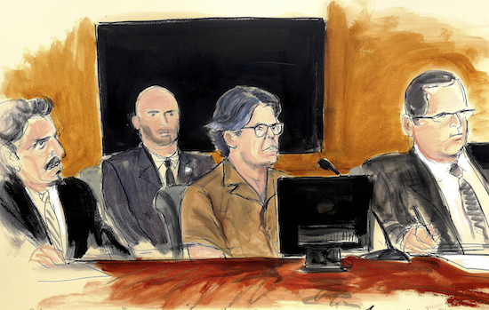 Keith Raniere, center, is accused of running a sex cult.
