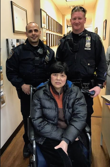 Police officers Yaser Shohatee (left) and Mathew Slavin bought victim Wu Xu a new wheelchair. Photo courtesy of state Sen. Martin Golden’s office