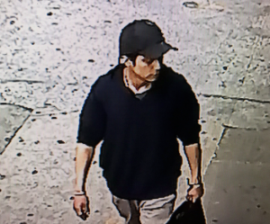 The Police Department released this image of the suspect walking away with the toddler in the stroller.