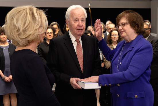 In this photo provided by the New York Attorney General's Office, Solicitor General Barbara Underwood, right, takes the oath of office at the State Capitol in Albany on Tuesday. Underwood became the state's acting Attorney General after Eric Schneiderman resigned amid accusations of abusing four women during intimate encounters. From left is New York Chief Judge Janet DiFiore, Underwood's husband Martin Halpern and Barbara Underwood. New York Attorney General's Office via AP